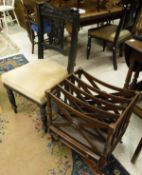 A pair of Victorian ebonised framed dining chairs and a mahogany four section canterbury in the