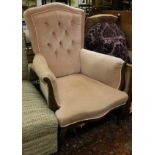 A mahogany framed arm chair in pink button back upholstery
