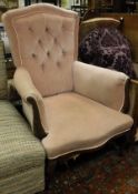 A mahogany framed arm chair in pink button back upholstery