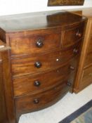 A Victorian mahogany bow fronted chest of two short over three long graduated drawers