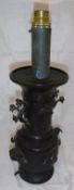 A Japanese chocolate patinated bronze vase table lamp decorated in high relief with birds amongst