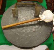 A beaten brass gong with malacca handled beater on a brass wall mount