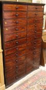 A Victorian mahogany chest of twenty four drawers, each inscribed with letters of the Alphabet,