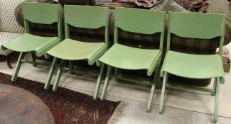 A set of four mid 20th Century Baumann chairs stamped beneath and inscribed ""Fabrique en France