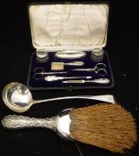 A George III silver ladle (London by Thomas Wilks Barber), a silver mounted brush (London by William