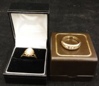 A three stone 9 carat gold ring, together with a further 9 carat gold ring set with a cameo