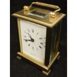 A five glass brass mantle clock with white enamel dial set with Roman numerals inscribed ""Shortland