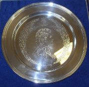 A cased mid 20th Century commemorative silver plate decipting Elizabeth II 1952-1977 ( London, 1977)