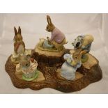 A collection of Beswick Beatrix Potter figures including Little Pig Robinson Spying 1987, Tailor