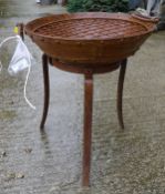 A modern firepit of small proportions with twin ring handles and studded decoration on stand*