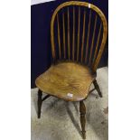 A set of five elm seated stick back dining chairs with turned supports to crinoline stretchers (
