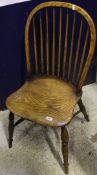 A set of five elm seated stick back dining chairs with turned supports to crinoline stretchers (