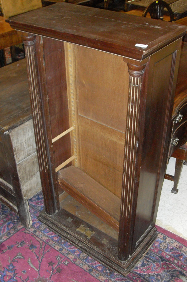 A 20th Century mahogany open bookcase of slim proportions,