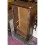 A 20th Century mahogany open bookcase of slim proportions,