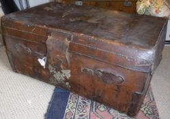 A leather cabin trunk with fitted interior,