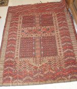 A red ground Persian rug in blacks,