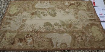 A large Aubusson style hanging depicting tiger, giraffe,