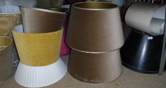 A large collection of lamp shades