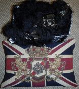 A box containing a Victorian shawl depicting a four toed dragon to the centre with embroidered