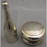 An Asprey silver Yo-yo (London 2001) and a Asprey and Garrard "Bubbles" soap bubble dispenser as a