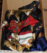A box containing seven various silk scarves to include Hermes, Chanel, Versace,