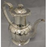 A late George III silver coffee pot, the finial with embossed fruit decoration,