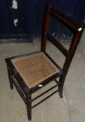A three tier folding cake stand, two cane seated hall chairs, nest of three mahogany tables,