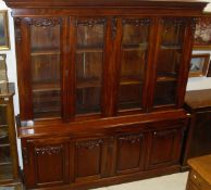 A mahogany bookcase cabinet in the Victorian manner,