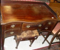 An Edwardian mahogany and inlaid dressing table with three quarter galleried top above a serpentine