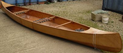 Two seater plywood canoe with oars CONDITION REPORTS Approx length 540 cm unknown