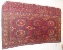 A Bokhara rug with six elephant foot ghouls in a stepped border 132 cm x 78 cm