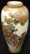 A Japanese Meiji period satsuma ware vase decorated with figures amongst flowers bearing gilt and