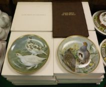 A set of twelve Limoges "Game Birds of the World" plates,