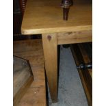 A modern pine rectangular farmhouse style table on square tapering legs