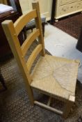 A set of 6 modern stained beech rush seat ladder back dining chairs