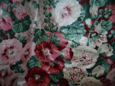 A pair of glazed cotton interlined curtains with all over floral design in a pink and green,