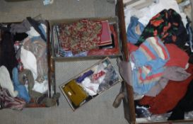 Two suitcases and two boxes of assorted fabric remnants,
