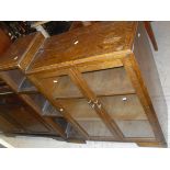 A reproduction 20th Century mahogany display cabinet with dental cornice above astragal glazed