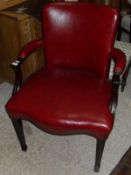 A 20th Century mahogany framed red leather upholstered armchair