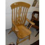 An elm seated Windsor type chair with pierced back splat,