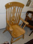 An elm seated Windsor type chair with pierced back splat,