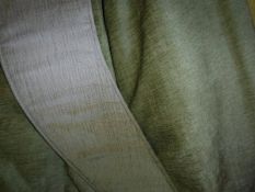 Two pairs of interlined curtains of chenile type plain green fabric and one pair of tie-backs