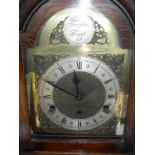 An oak cased long case clock of small proportions and brass dial inscribed "Tempus Fugit" to the