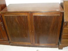 A 19th Century mahogany two door cupboard with four linen press drawers