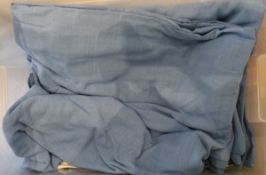A collection of plain blue woven cotton bedspreads and matching valances,
