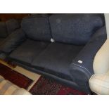 A two seater and a three seater sofa in blue self-patterned upholstery on turned supports to brass