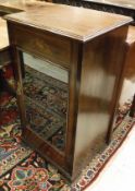 An Edwardian and satinwood banded music cabinet with raised back over a single glazed door,