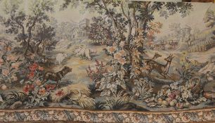 A large Belgian tapestry depicting landscape with animals including dogs, pheasants,
