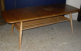 A light elm Ercol coffee table with spindled beech supports