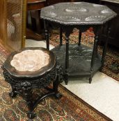 A late 19th Century Chinese rosewood urn stand,